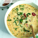 bowl of sausage potato and kale soup