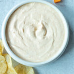 smoked paprika dip in bowl with chips