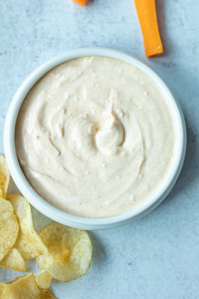 smoked paprika dip in bowl with chips