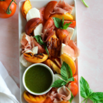 grilled peach caprese salad on plate