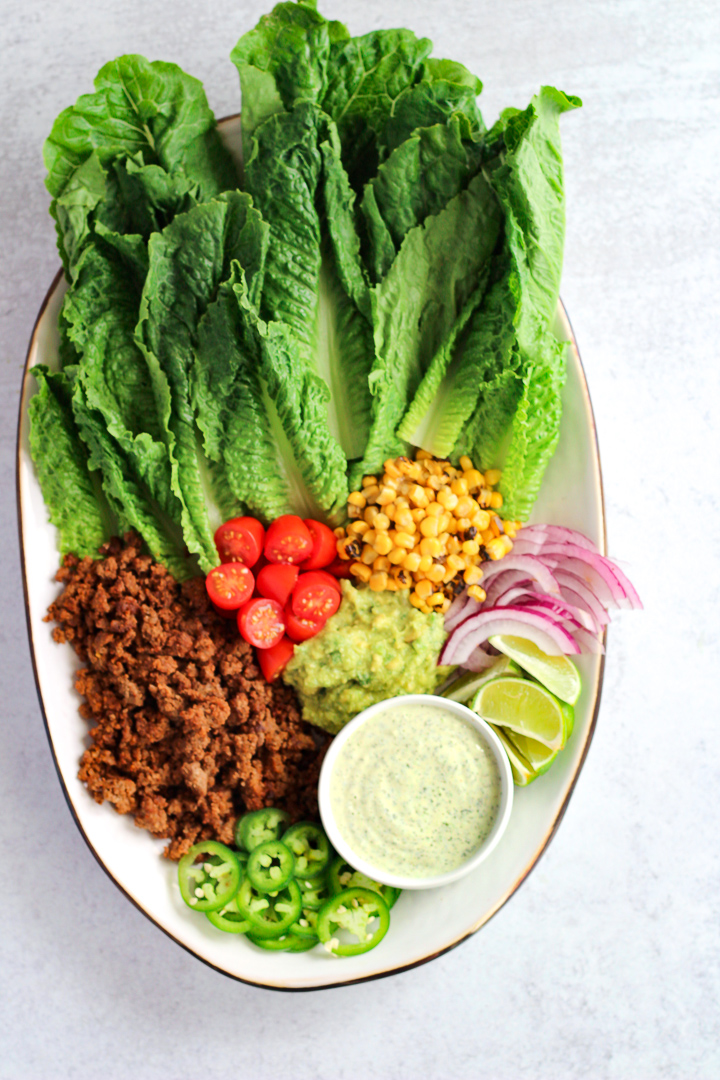 Taco salad with jalapeno ranch dressing on large platter