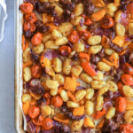sheet pan gnocchi with vegetables and sausage on baking sheet