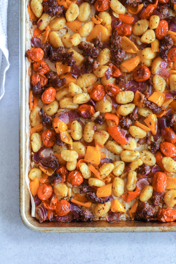 sheet pan gnocchi with vegetables and sausage on baking sheet