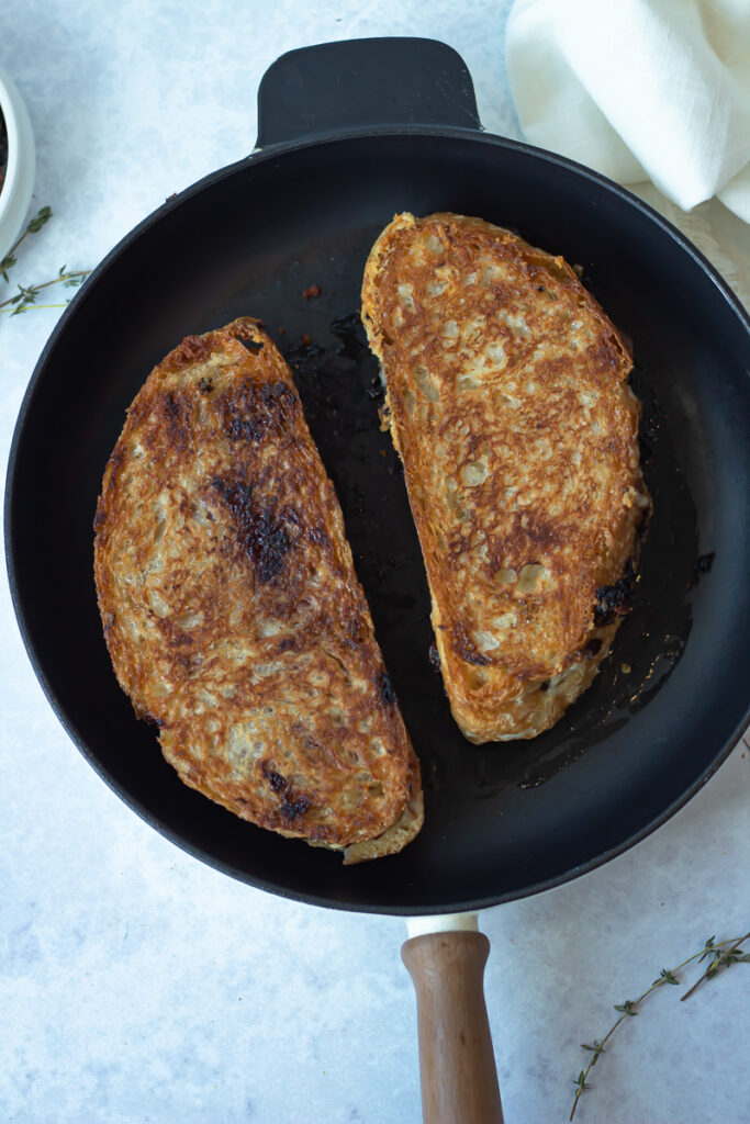grilled cheese sandwich with rose caramelized onion jam on pan