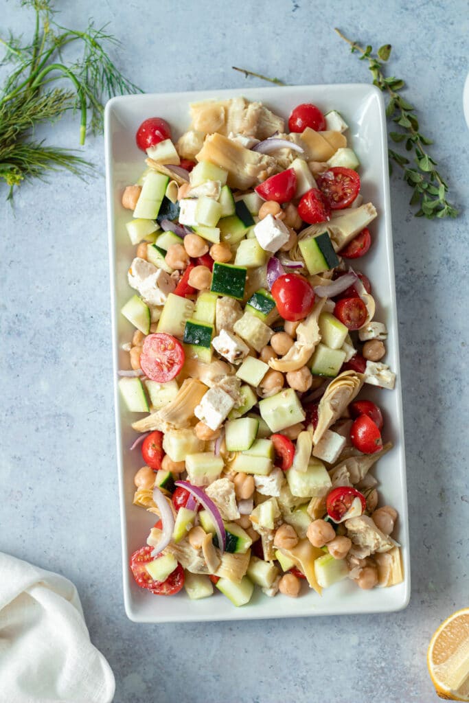 greek salad with marinated feta on platter