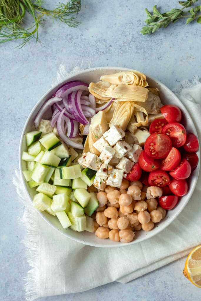 ingredients for marinated greek salad in small plate