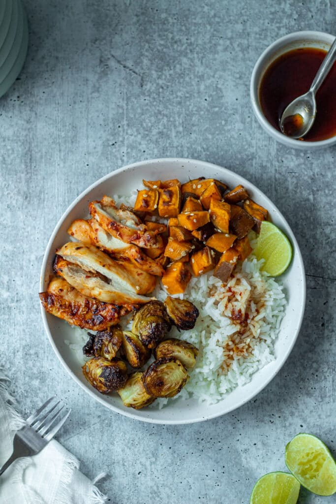 finished chicken and rice bowl with roasted vegetables