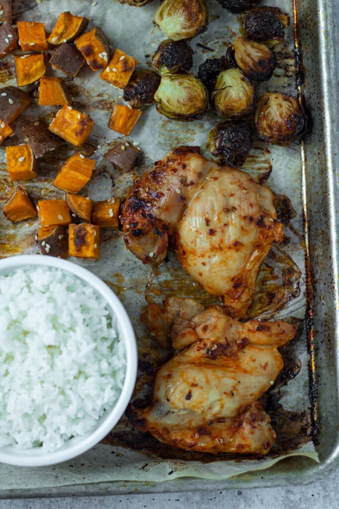 close up of roasted chicken on sheet pan