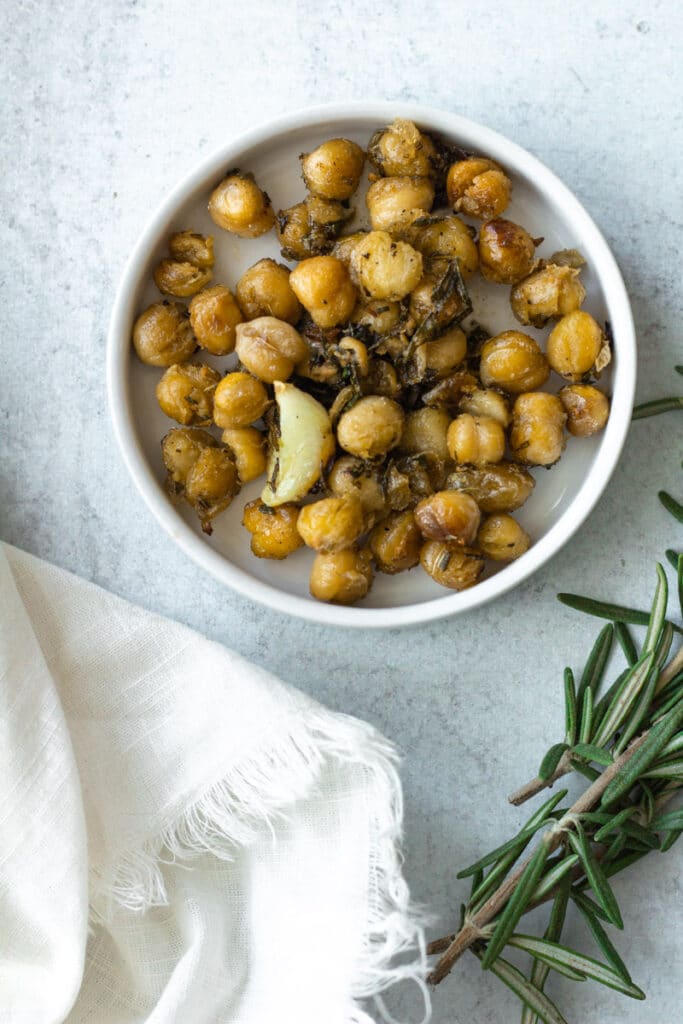 crispy chickpeas with garlic and rosemary on small plate