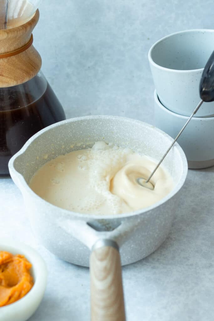 pumpkin creamer being mixed in small pot