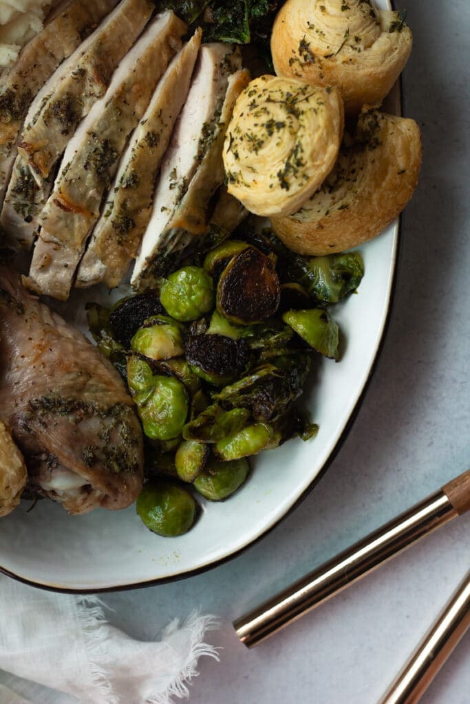 brussels sprouts on thanksgiving platter with turkey, mashed potatoes