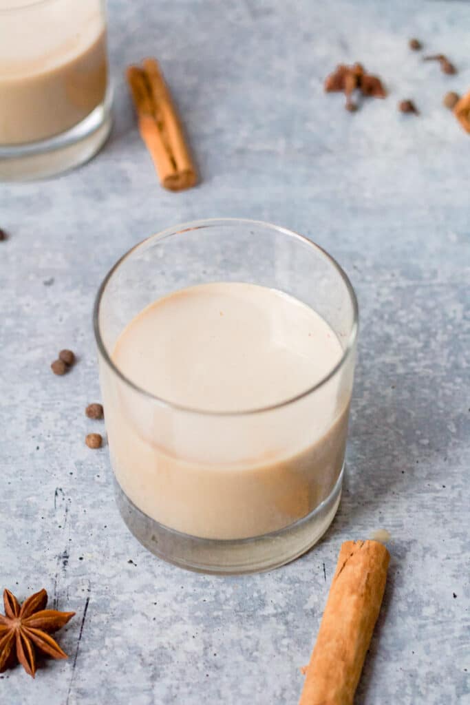 glass of white russian with spices on board