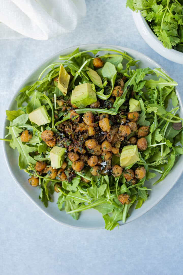 Arugula salad with pan fried chickpeas and avocado