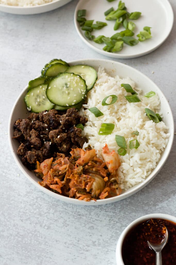 beef bulgogi bowl with toppings and sides