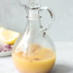 Lemon garlic vinaigrette in glass salad dressing bottle