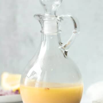 glass bottle of lemon garlic vinaigrette