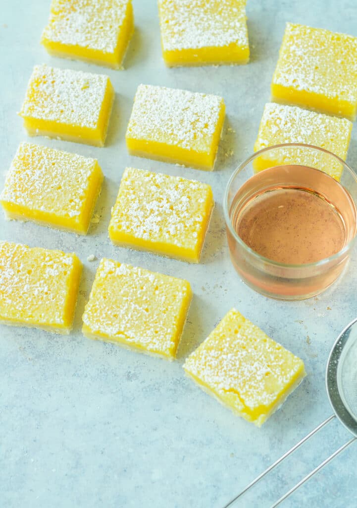 cut lemon rosé bars with small glass of rosé wine