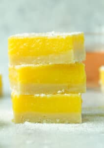 Stack of three lemon rosé bars with powdered sugar on top