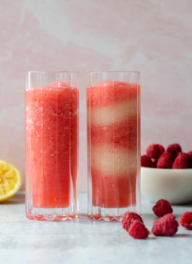 Two glasses of frosé; one with layers of raspberry and lemon flavored