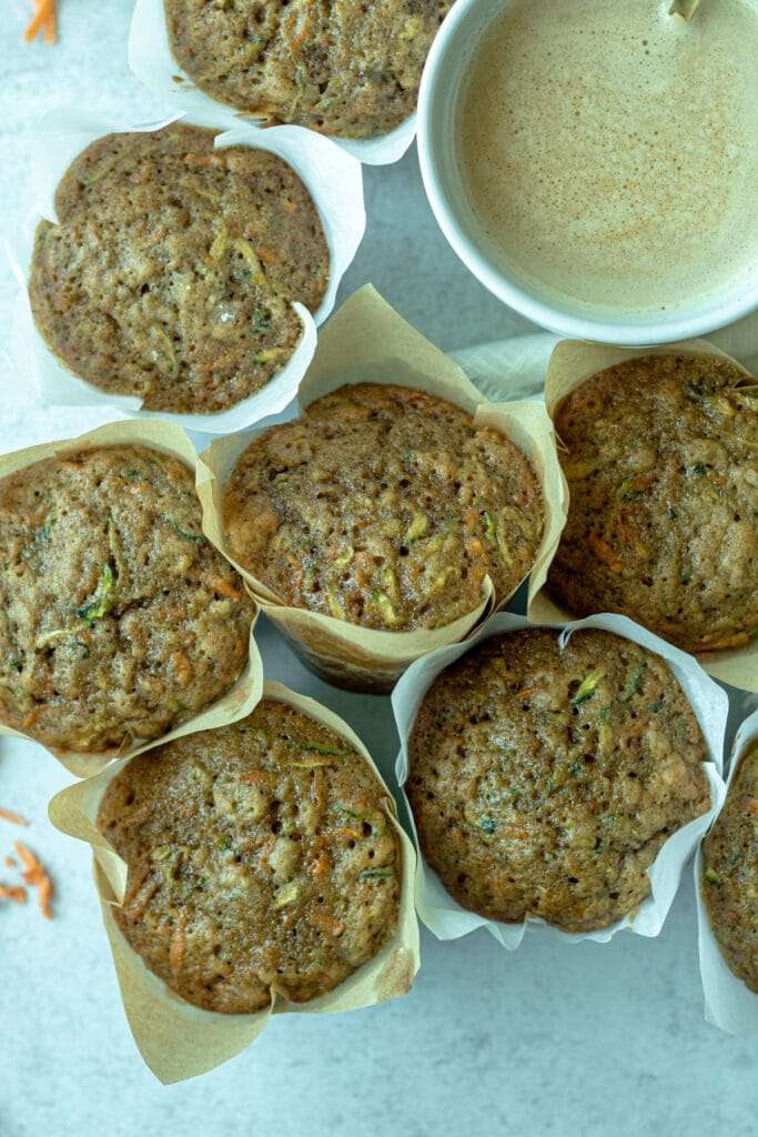 group of sweet potato zucchini muffins with coffee