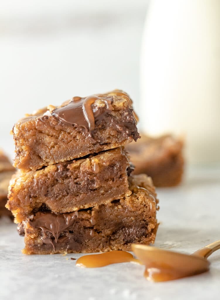 stack of chocolate chunk bars with caramel drizzle