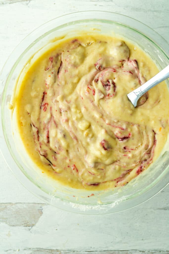 cranberry sauce muffin batter in glass bowl