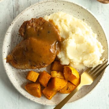 plate of apple cider chicken and butternut squash with mashed potatoes