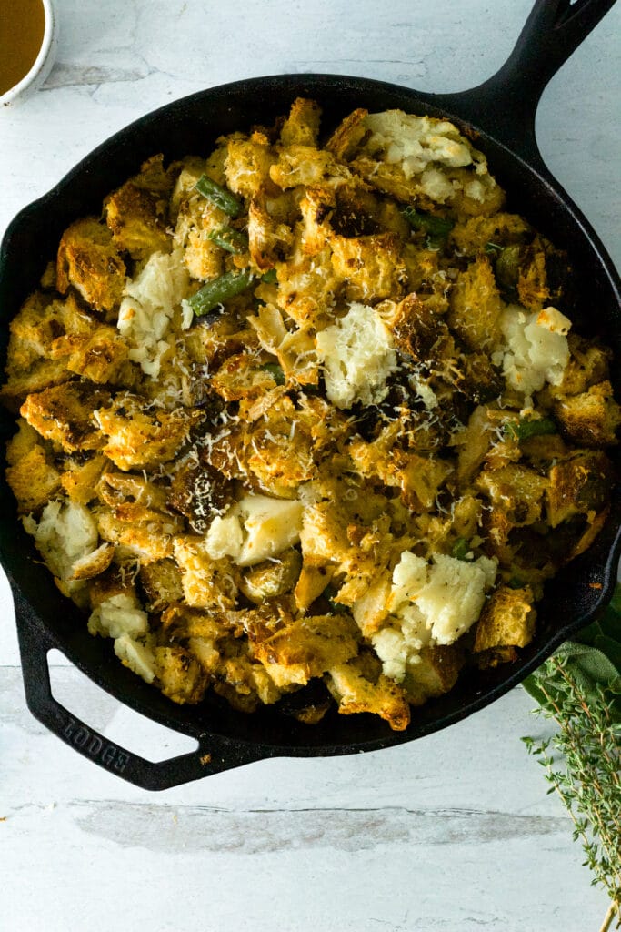 cast iron pan with thanksgiving strata on table