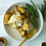 serving of thanksgiving strata on plate with garnish and herbs