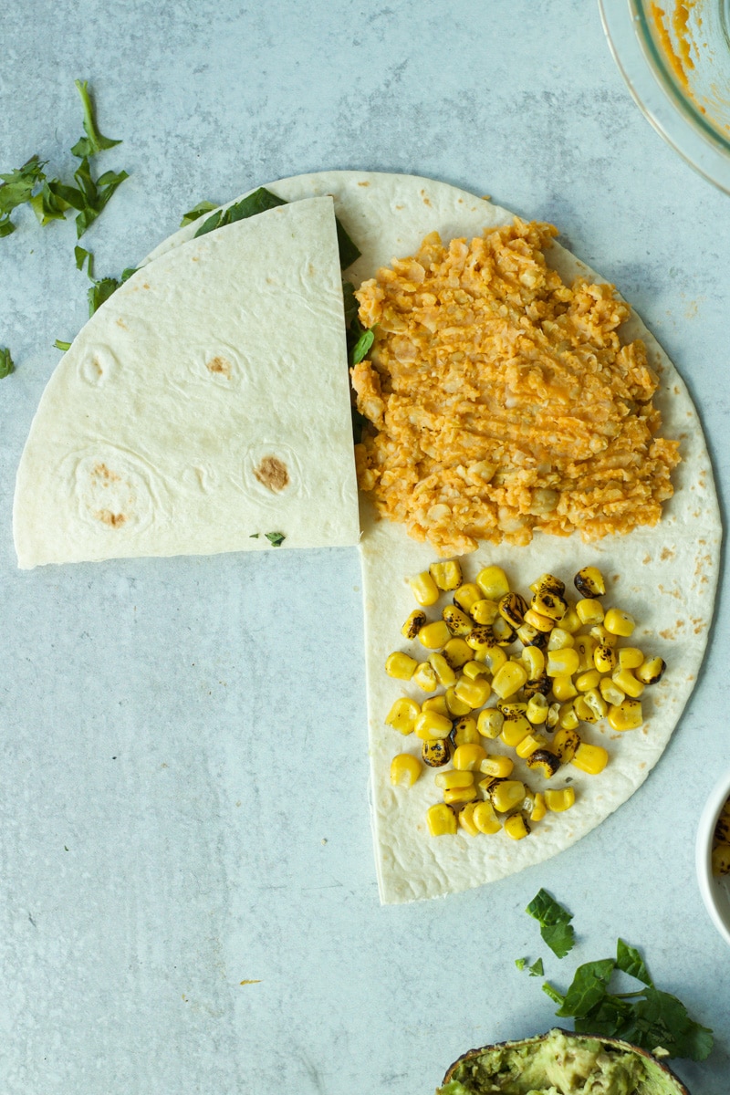 First fold of buffalo chickpea wrap.