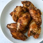 Plate of air fryer frozen chicken wings.