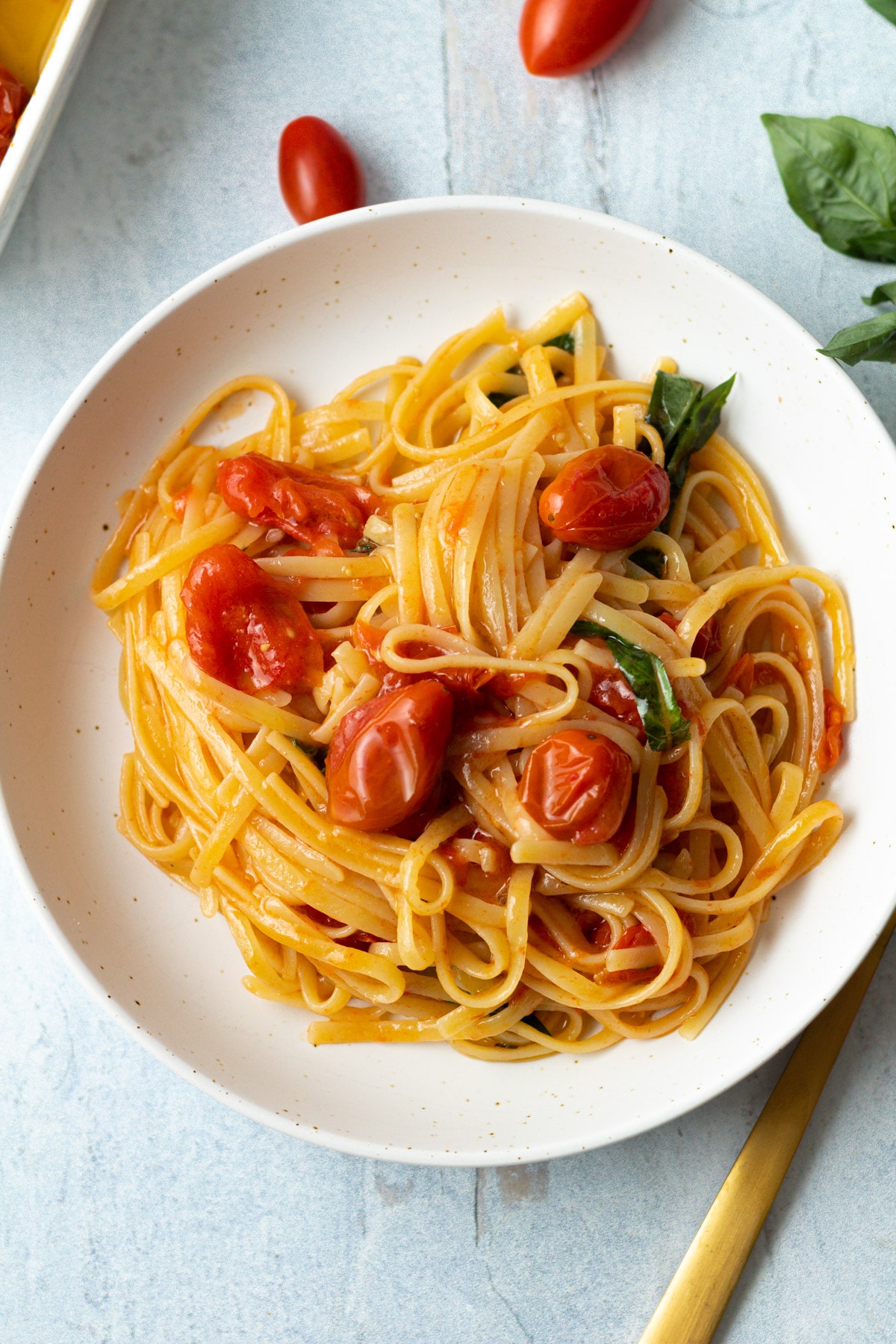Small bowl of tomato confit pasta.