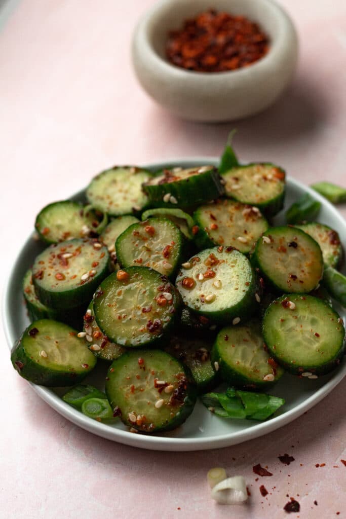 Finished spicy asian cucumber salad on plate.