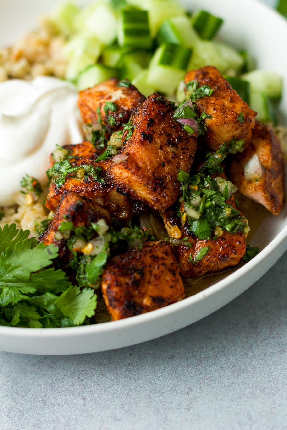 Spiced salmon with cilantro chumichurri drizzle.