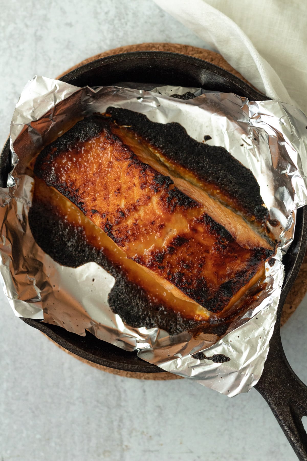 Broiled miso honey salmon in foil lined pan.