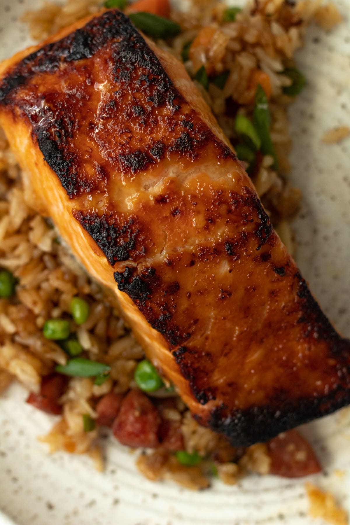 Close up shot of broiled miso honey salmon on plate.