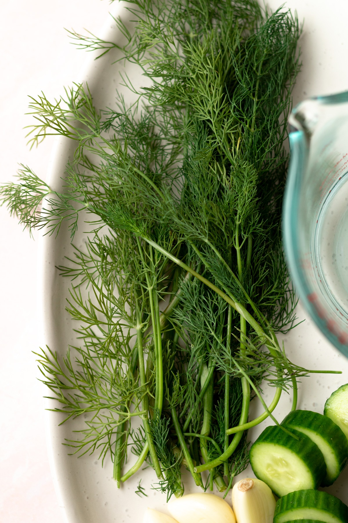 Large bunch of dill on plate.