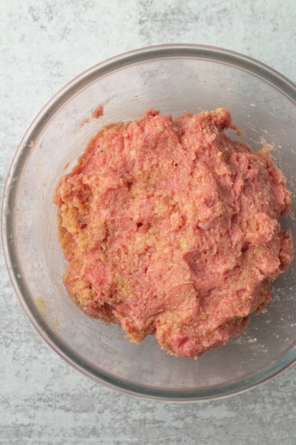 Bowl of meat mixture for turkey meatballs.