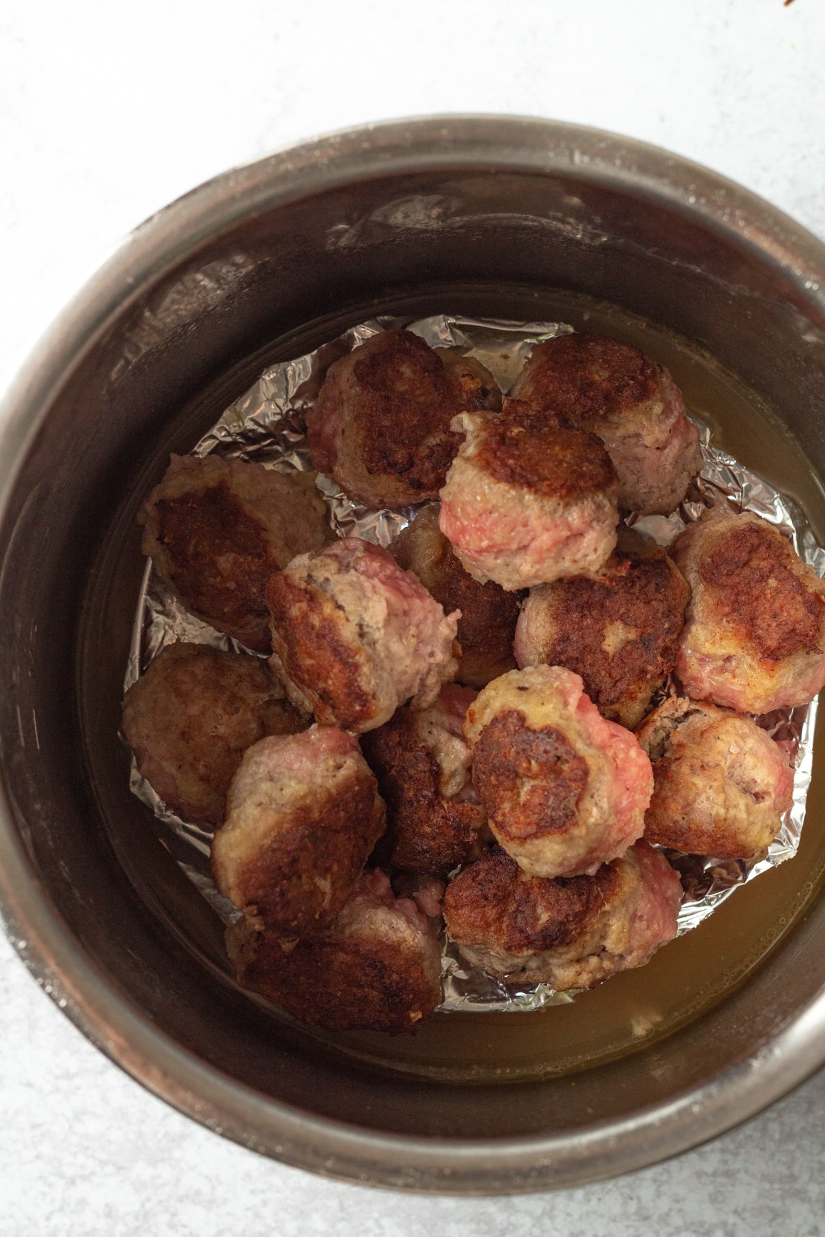 Turkey meatballs piled in instant pot.