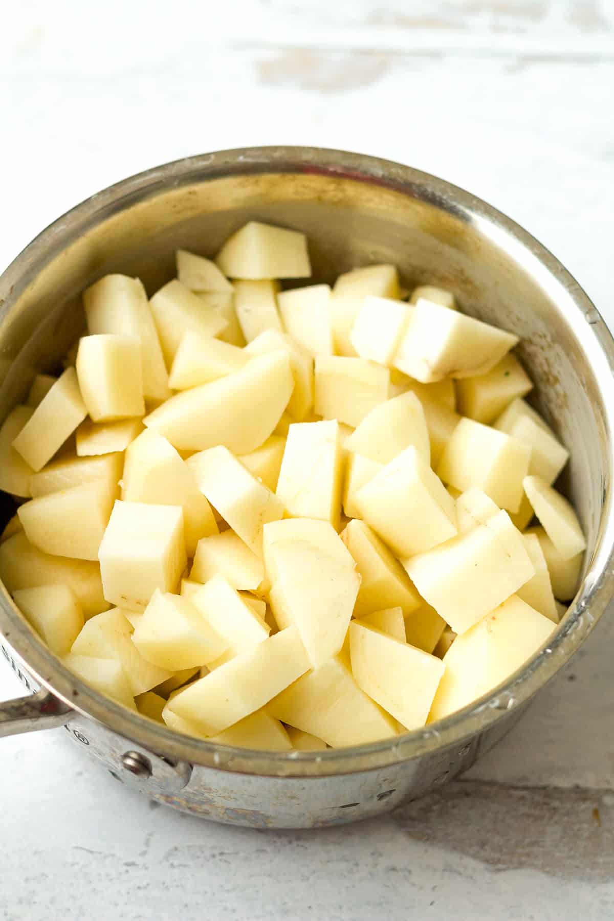 Diced potatoes in pot.