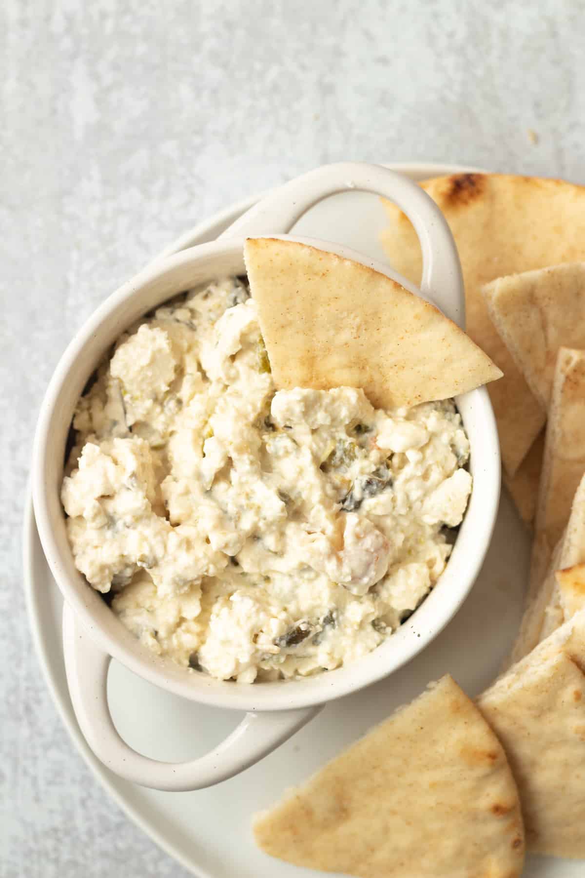 Feta dip with pita wedge.