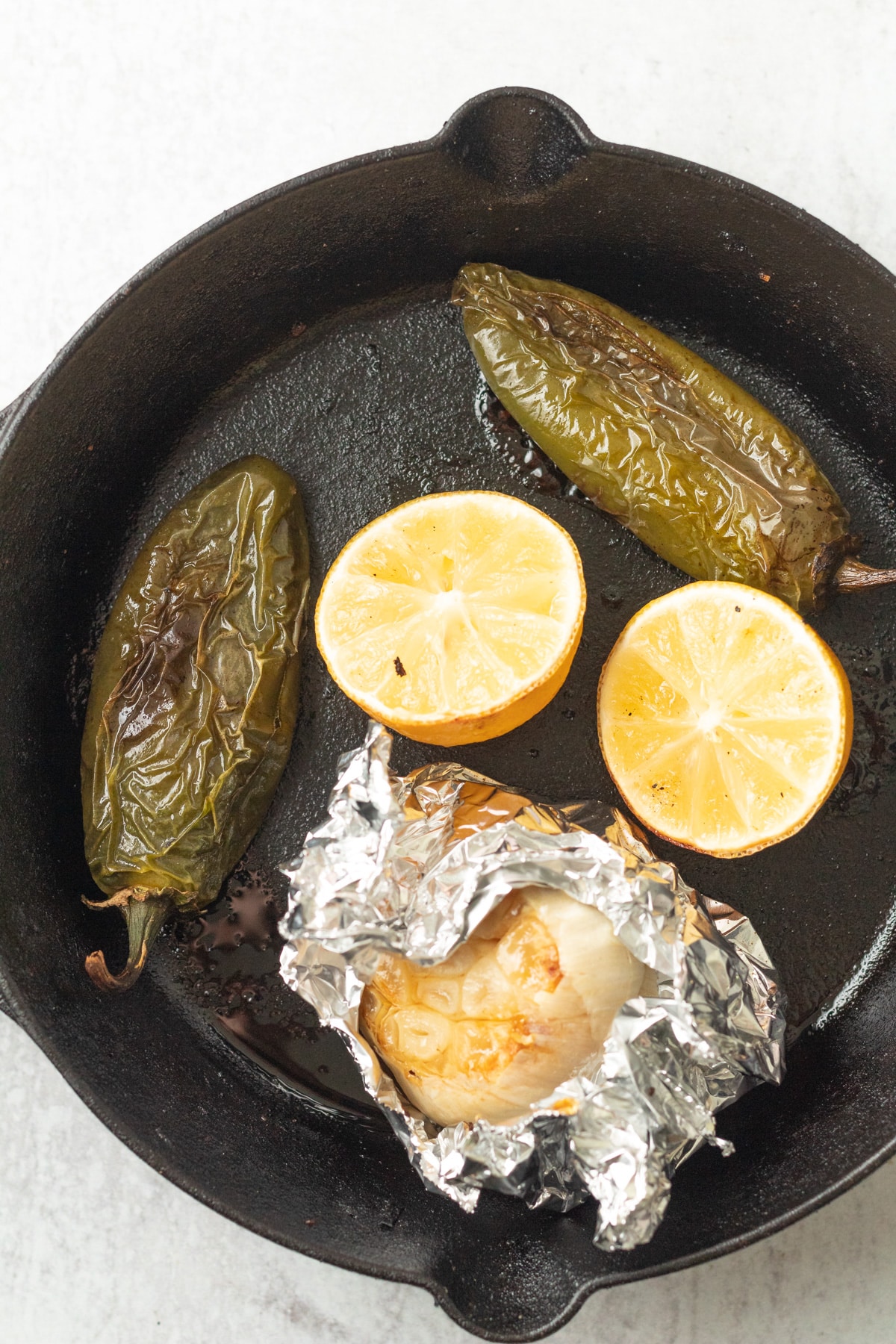 Roasted peppers, garlic and lemon on cast iron.