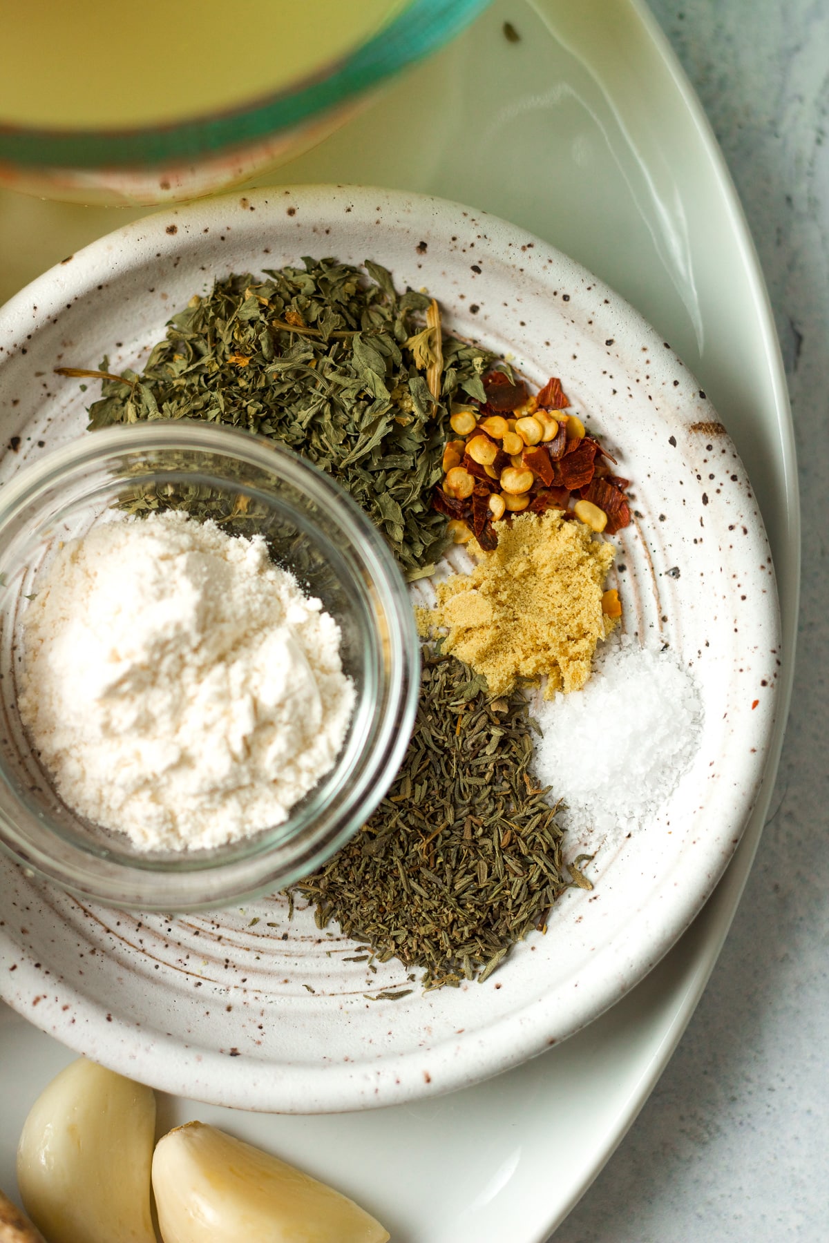 Spices and flour on small plate.