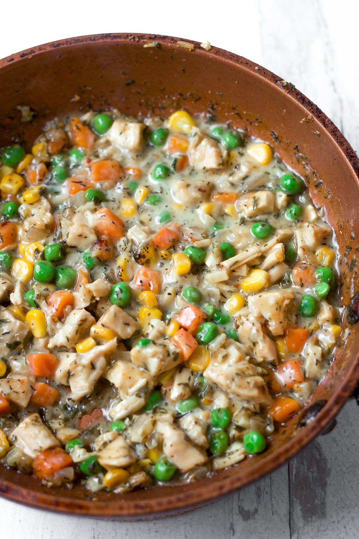 Chicken pot pie filling in pan.