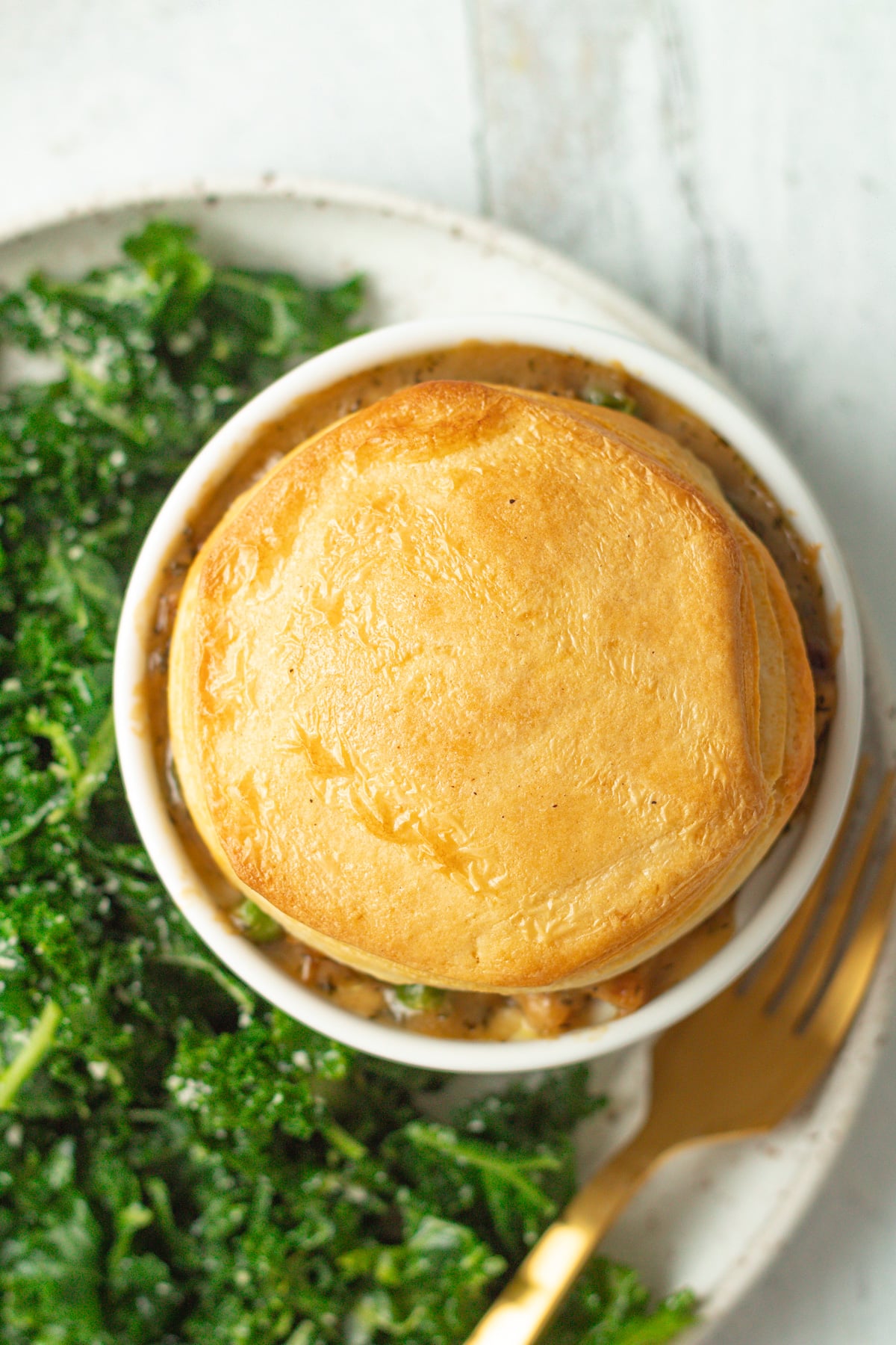 Close up shot of biscuit top of chicken pot pie for one.