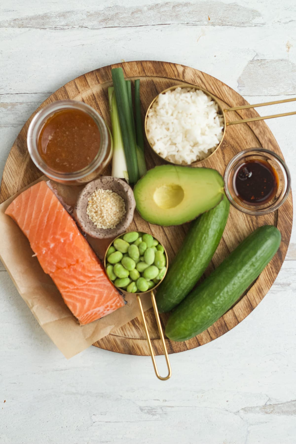 Ingredients for crispy rice salmon salad on wooden board.